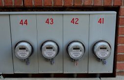 Four meter boxes against brick building