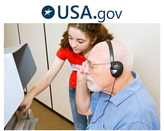 Elections worker assists man wearing headphones at voting booth