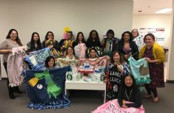 DSCC's Lombard RO staff poses with blankets they made for caregivers