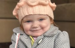 Eloise Hoffman smiles while holding a straw