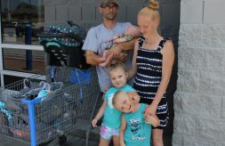 DSCC participant Renesmae poses together with her two little brothers and mom and dad outside Walmart